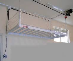 Consider putting the finished picture i have two extra overhead cabinets and couldn't figure out the best way to get storage above my. Motorized Storage Garage Storage Lift No Ladder Required Diy Overhead Garage Storage Overhead Garage Storage Garage Ceiling Storage