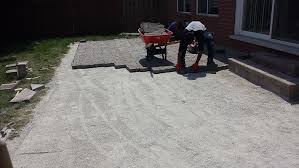Install patios, like flagstone patios, with concrete or sand. Ensuring The Longevity Of Your Interlocking Driveway And Patio Choosing The Right Sand During Installation Markstone Landscaping
