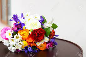 Sweet peas, wisteria, and lobelia are three trailing purple flowers that make gorgeous accents in a cascading bouquet. Unusual Bright Wedding Bouquet With Ranunculus Roses And Irises Stock Photo Picture And Royalty Free Image Image 41174614