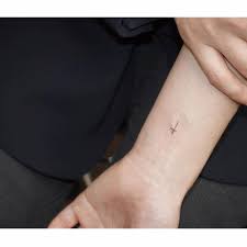 It's also one of those symbols that is easily recognized. Minimalist Cross Tattoo On Wrist