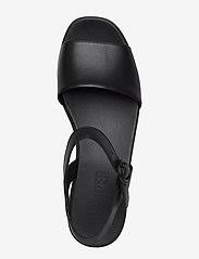A slightly squared toe and an inset footbed update the look of a comfortable, everyday sandal lifted on a low platform wedge. Camper Misia Sandals Boozt Com
