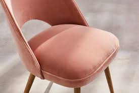 The curved backrest, legs and frame of the chair are finished in a matte black design. Benchmark Handmade English Furniture Theda Chair