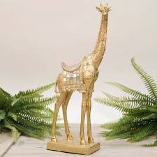 Add life to your home and garden by inserting a resin statuary figure. Giraffe Ornament Figurine Finished In Gold Home Decor Ornament