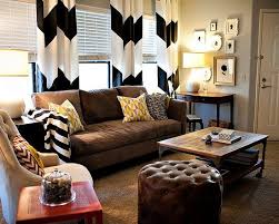 Black And White Living Room With Brown Couch Black And White Chevron Curtains Brown Leather Sofa Soft Gray Walls Pops Of Color On The Pillows Tufted Ottoman Silhoue Home Home Decor Home Living Room