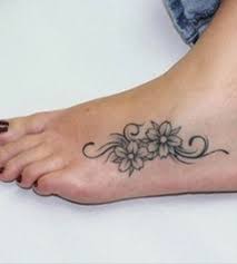 Small Flower Tattoos On Girl S Feet Small Foot Tattoos Tattoos For Women Flowers Foot Tattoos For Women