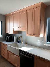 With large windows, the room floods with sunlight highlighting the light maple cabinets with glaze that brings out the. Cabinets Direct Pensacola