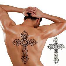 The skull tattoo is creatively big and has a cross symbol emanating from a hole on the forehead, which is very scary. 1pcs Big Cool Mens Cross Tattoos Mens Sexy Arm Back Cross Waterproof Large Size Temporary Tattoo Stickers 30 21cm Wish
