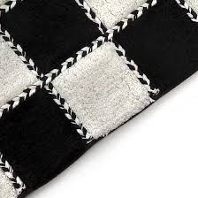 Add a bold or subtle statement to your bathroom with a black and white bath rug. Mackenzie Childs Covent Square Bath Rug Black White