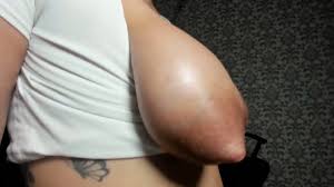 Show me her big lactating tits from the side and bounce them