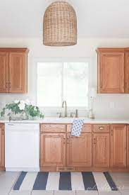 Or, you can paint the cabinets with latex paint or even milk paint. How To Update A 90 S Kitchen Without Painting The Cabinets Oak Kitchen Cabinets Oak Kitchen Oak Cabinets