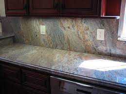 12 gorgeous kitchens with waterfall countertops. Backsplash Tiles For Kitchen Pecock Here Is A Picture Granite Backsplash Kitchen Backsplash Pictures Marble Countertops