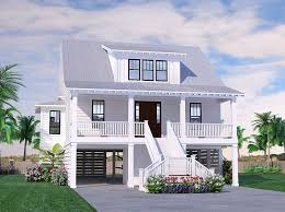 We love the use of wood and stone and the steep vaulted ceilings that fill the house with warmth and character. Seabright Cottage Coastal House Plans From Coastal Home Plans