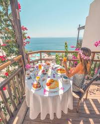 An Amazing Breakfast On Balcony Surrounded By Pink Bougainvillea And Infinity Blue Sea Photography By Jennifer Tuffen Iz Holiday Instagram Sea Photography