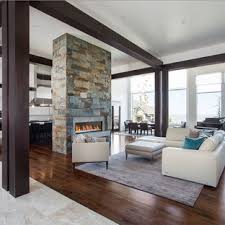 Liking a the warmth but still modern and clean. 75 Beautiful Living Room With A Two Sided Fireplace Pictures Ideas July 2021 Houzz