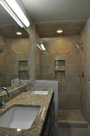 The narrow and long bathroom is arranged so that all sanitaryware are on one long wall to emphasize the natural shape of the space. Narrow Bathroom Design Ideas Pictures Remodel And Decor Narrow Bathroom Designs Narrow Bathroom Bathrooms Remodel