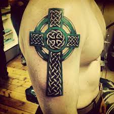 Black ink 3d celtic cross with dragon tattoo design for shoulder. 46 Celtic Cross Tattoos Designs