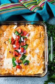 It is perfect for the warmer months because you can enjoy your favorite chicken enchiladas without heating up the kitchen. Layered Chicken Enchilada Casserole Recipe Berly S Kitchen