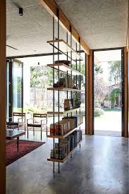 Black And Decker Plant In Texas 2020 Metal Poles Wooden Shelves Diy Room Divider Books Cement Floor Wooden Chairs Red Carpet In 2020 Rustic Living Room Trendy Living Rooms Bedroom Design