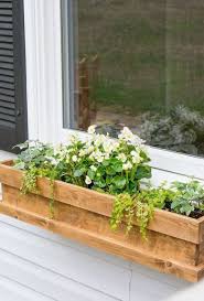 Black/bronze plastic window box plants look beautiful in the 15 in. 25 Window Box Planters To Welcome Spring Digsdigs