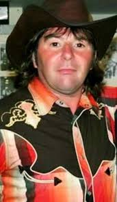 Who is the cowboy dude everyone is taking pics with?