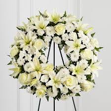 These babies flower wreathes are hand delivered to the funeral or visitation, made of freshly cut blooms, and come with a message card for the family. All White Funeral Wreath Roslindale Florist