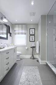 And the vanity is neat and very. Gray Tile Floor With White Vanity Bathroom Ideas Love How They Have The Tiles That Looks Like The Timeless Bathroom Bathroom Trends Bathroom Remodel Master