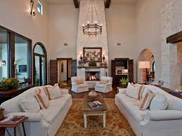 Power sofas, loveseat with console, power lift recliner Neutral Spanish Living Room With Tall Stone Fireplace Hgtv