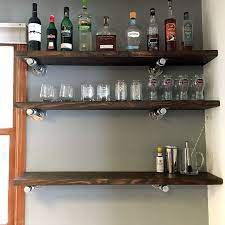 These diy floating shelves appear to float on the wall because the hardware is hidden from sight. 40 Floating Shelf Ideas Built With Industrial Pipe Simplified Building