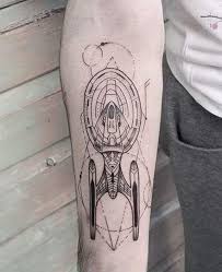 Star tattoo designs look cool and they are a good preference for a very first ink piece because a star is typically small in design and doesn t need to be awfully intricate. Star Trek Enterprise E Tattoo Star Trek Tattoo Tattoos Voyager Tattoo