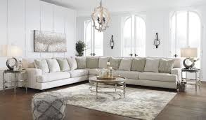 A sectional is a great option if you prefer one piece that can act as focal point in your living room. Rawcliffe Parchment 4 Piece Sectional Ashley Furniture Furniture Living Room Designs