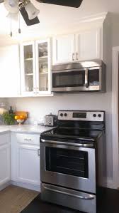 small kitchen, white cabinets, carrara