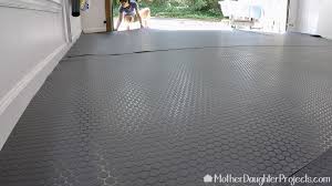 Are you constantly tinkering on cars and for the most garage floor customization, the coolest design options, and the studliest look, hard plastic garage floor tiles are going to be your jam. Diy Vinyl Garage Flooring Vinyl Garage Flooring Flooring Garage Floors Diy