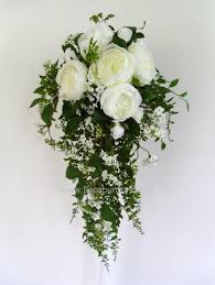 To achieve a natural look on your wedding day, swap a floral bouquet for one with lots of foliage instead. Florabunda White Cascading Bride S Bouquet With Lots Of Greenery