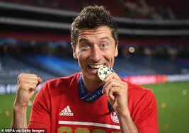 Lewandowski's unique goal celebration at bayern of crossing his arms. Robert Lewandowski Wakes Up Next To Champions League Trophy As Bayern Munich Star Celebrates Triumph Daily Mail Online