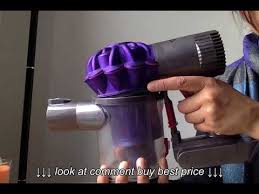 Most dysons, going back to their first uprights, have a grey knob/button toward the top of the canister that will disconnect the clear plastic can from the funnels above. Dyson V6 Animal How To Empty And Replace The Dust Canister Or Bin Youtube