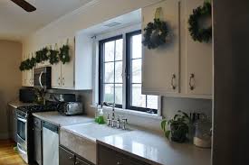If the space above the kitchen cabinets is open you essentially have a high shelf that can be used to display decorative items or even to store items that are infrequently used. Kitchen Diy Crown Molding On A Soffit Park And Division