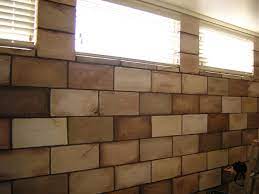 If your basement features cinder block walls, then use decorating ideas to brighten up the space and make it feel more inviting. This Cinder Block Paint Would Look Cool In The Kennels Concrete Block Walls Cinder Block Walls Painting Concrete