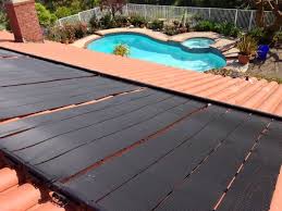 Solar pool discs are more efficient than pool covers and they're frankly more convenient. Solar Pool Faqs Ameco Solar Solar Pool Heating Solar Pool Solar Pool Heater