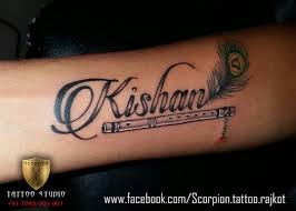 Kishan Name Tattoo With Flute And Peacock Feather Krishna Tattoo Name Tattoo Designs Feather Tattoos