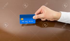 You may be charged a late payment fee and face other consequences for being just one day late on a credit card payment. Hand Of Businessman Showing The Credit Card To Make A Payment Stock Photo Picture And Royalty Free Image Image 51013234
