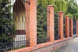 Latest modern gates designs ideas 2021 from hashtag decor for modern home exterior decorating ideas and safetyhome garden gates design ideas, fence gate desi. Brick And Metal Fence With Door And Gate Of Modern Style Design Stock Photo Picture And Royalty Free Image Image 89316048