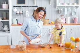 Maybe you would like to learn more about one of these? Mother And Son Are Smiling While Having A Breakfast In Kitchen Stock Photo Picture And Royalty Free Image Image 84919255