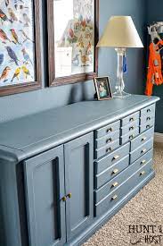 In order to ensure the best finish, add two coats of either primer or a base color to the chest of drawers using a paint roller. Diy Bedroom Dresser Makeover Salvaged Living
