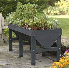 Hook this elevated planter to a timer and have a hands off way to grow greens or flowers. 5 Favorites Wooden Elevated Planters Gardenista