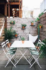 14 Ideas To Make A Small Garden Look Bigger Gardenista Outdoor Dining Spaces Outdoor Dining Patio Decor