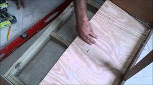kitchen sink cabinet bottom wood floor