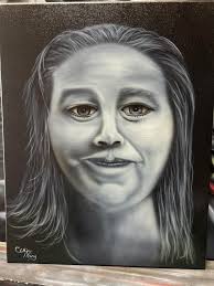 Airbrushing memorial pieces with portraits