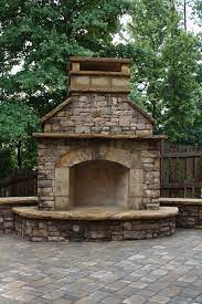 Only the beam came on. Stacked Stone Outdoor Fireplace With Hearth And Seating Wall Outdoor Fireplace Patio Outdoor Stone Fireplaces Backyard Fireplace