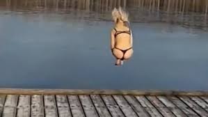 Video Woman Fractures Ankle Attempting To Jump Into Frozen Lake Daily Mail Online