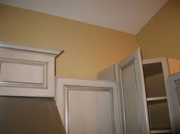 The more detailed door style, a more detailed crown would be appropriate. Crown Transitions For Corner Cabinets